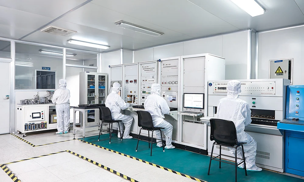 Operators working with measurement equipment in a test laboratory